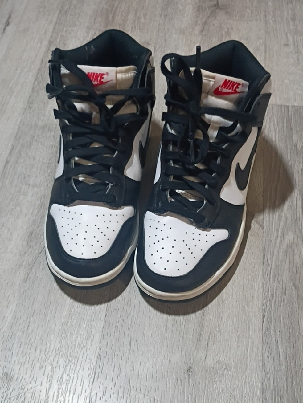 Nike Black & White High-Top Sneakers with Red Tongue Logo